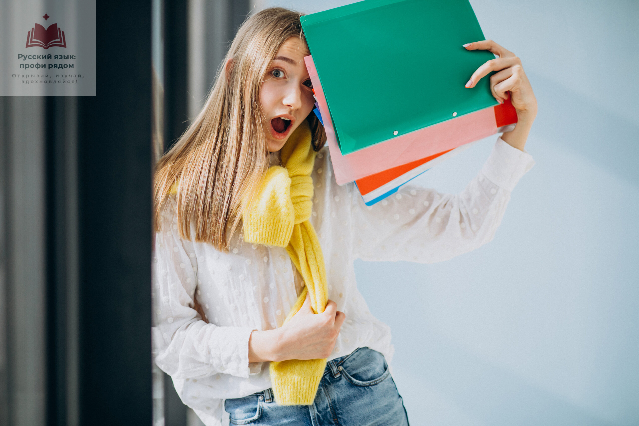 Girl student standing with colorful folders